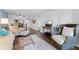 Comfortable living area with hardwood flooring, a dining area, and ample seating at 1901 Oyster Catcher Ln # 823, Clearwater, FL 33762