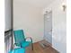 Cozy front patio features a chair, table, and tiled floor near unit 823 at 1901 Oyster Catcher Ln # 823, Clearwater, FL 33762