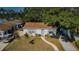 Charming single-story home with a well-manicured lawn, sidewalk, and a driveway with a minivan parked at 2261 Queen S St, St Petersburg, FL 33712
