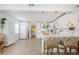 Open kitchen featuring white cabinetry, island with seating, and stainless appliances at 2261 Queen S St, St Petersburg, FL 33712
