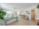 Bright, airy living room with open concept to dining, kitchen and bath, enhanced by stylish decor and neutral tones at 2261 Queen S St, St Petersburg, FL 33712