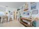 Coastal-themed living room with bright white walls, light tile floors, and natural wood accents at 2261 Queen S St, St Petersburg, FL 33712