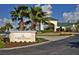 Elegant Feather Sound Country Club entrance featuring lush landscaping and architectural design at 2312 Heron Cir, Clearwater, FL 33762