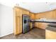 Bright kitchen with wooden cabinets, stainless-steel appliances, and tile flooring at 2312 Heron Cir, Clearwater, FL 33762