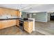 Updated kitchen boasts granite countertops, wooden cabinets, and stainless-steel appliances at 2312 Heron Cir, Clearwater, FL 33762