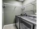 Laundry room featuring a modern washer and dryer with wire shelving at 2312 Heron Cir, Clearwater, FL 33762
