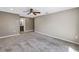 Comfortable main bedroom with neutral walls, carpet floors and views to a bathroom at 2312 Heron Cir, Clearwater, FL 33762