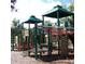 Outdoor playground structure with slides, ladders, and climbing walls at 2312 Heron Cir, Clearwater, FL 33762