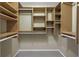 Bright walk-in closet with shelving and hanging rods offer ample storage at 2312 Heron Cir, Clearwater, FL 33762