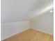 Bright, unfinished attic space with wood floors and ample storage opportunity at 2581 Forest Run Ct, Clearwater, FL 33761