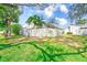 Spacious backyard with mature trees and privacy fence offers plenty of room at 2581 Forest Run Ct, Clearwater, FL 33761