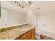 Bathroom featuring a granite vanity, tub and shower combination at 2581 Forest Run Ct, Clearwater, FL 33761