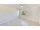 Light-filled bedroom with tile flooring and a window view at 2581 Forest Run Ct, Clearwater, FL 33761