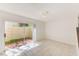 Cozy bedroom with sliding glass door, neutral walls, tile floors, and access to the outdoor area at 2581 Forest Run Ct, Clearwater, FL 33761