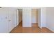 Bright bedroom with hardwood floors, closet and attic access for ample storage at 2581 Forest Run Ct, Clearwater, FL 33761