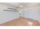 Bedroom featuring laminate floors, ceiling fan and closet at 2581 Forest Run Ct, Clearwater, FL 33761