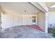 Carport with exterior storage closet and brick entryway to front door at 2581 Forest Run Ct, Clearwater, FL 33761