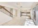 Bright kitchen and dining area with stainless steel appliances, tile floors, and sliding glass door access at 2581 Forest Run Ct, Clearwater, FL 33761