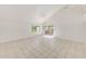 Bright living room with tile flooring, high ceilings, a ceiling fan, and a sliding glass door to the outside at 2581 Forest Run Ct, Clearwater, FL 33761