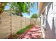 Private brick patio with light wooden fence, great for outdoor seating at 2581 Forest Run Ct, Clearwater, FL 33761