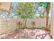 Charming brick patio with privacy fence and mature landscaping at 2581 Forest Run Ct, Clearwater, FL 33761