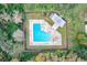 Overhead view of a community pool surrounded by mature trees at 2581 Forest Run Ct, Clearwater, FL 33761