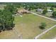 Expansive ranch home on sprawling acreage with lush landscaping and mature trees, offering privacy and serene country living at 260 Moccasin Hollow Rd, Lithia, FL 33547
