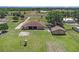 Aerial view of property with spacious backyard, outbuildings, and surrounding landscape at 260 Moccasin Hollow Rd, Lithia, FL 33547