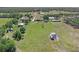 Aerial view of expansive acreage and home with separate buildings and plenty of privacy at 260 Moccasin Hollow Rd, Lithia, FL 33547