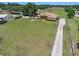 Ranch-style home boasts a well-manicured lawn, mature trees, and a long driveway for a secluded and peaceful setting at 260 Moccasin Hollow Rd, Lithia, FL 33547
