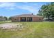 Back view of home with screened lanai and huge backyard with room to roam at 260 Moccasin Hollow Rd, Lithia, FL 33547