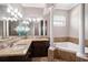 Bathroom features a large soaking tub, granite countertops, dual sinks, and decorative tile flooring at 260 Moccasin Hollow Rd, Lithia, FL 33547