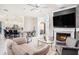 Open-concept living room with a fireplace and seamless flow to the kitchen and dining area at 260 Moccasin Hollow Rd, Lithia, FL 33547