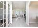 Bright and airy living room showcasing marble tile flooring and an open floor plan at 260 Moccasin Hollow Rd, Lithia, FL 33547