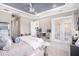 Spacious main bedroom offers a decorative ceiling fan and access to an outdoor patio area at 260 Moccasin Hollow Rd, Lithia, FL 33547