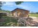 Outbuilding with a brick firepit that provides a space for outdoor gatherings at 260 Moccasin Hollow Rd, Lithia, FL 33547