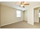 Comfortable bedroom features a window for natural light, closet, and ceiling fan at 3103 Taragrove Dr, Tampa, FL 33618