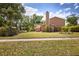 Charming home featuring mature trees and landscaping and a view of a tree-lined street at 3103 Taragrove Dr, Tampa, FL 33618