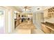 Full kitchen view featuring an island, stainless appliances, granite countertops, and natural light at 3103 Taragrove Dr, Tampa, FL 33618