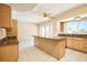 Bright eat-in kitchen with an island, stainless appliances, and a window over the sink offering natural light at 3103 Taragrove Dr, Tampa, FL 33618