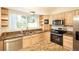 Close up view of the kitchen with stainless appliances and granite countertops at 3103 Taragrove Dr, Tampa, FL 33618