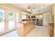 Eat-in kitchen with stainless steel appliances, granite countertops, and double doors leading to the yard at 3103 Taragrove Dr, Tampa, FL 33618