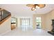Expansive living area featuring a wet bar, staircase, and bright windows that flood the space with natural light at 3103 Taragrove Dr, Tampa, FL 33618