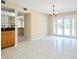 Well-lit living area that leads to the outdoor patio through sliding glass doors, enhancing the indoor-outdoor flow at 3103 Taragrove Dr, Tampa, FL 33618