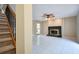 Bright living room featuring a decorative fireplace, tile floors, and natural light, perfect for relaxing at 3103 Taragrove Dr, Tampa, FL 33618