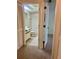 En-suite bathroom with white tile, toilet, and vanity, accessible from bedroom at 3629 Indigo Pond Dr # 3629, Palm Harbor, FL 34685