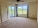 A bedroom with a sliding glass door that leads out to a balcony at 3629 Indigo Pond Dr # 3629, Palm Harbor, FL 34685