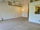 A living room featuring carpet, ceiling fan and light fixture at 3629 Indigo Pond Dr # 3629, Palm Harbor, FL 34685