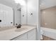 An updated bathroom features a bath tub, shower and single sink vanity at 406 W Cedar St # 403, Tampa, FL 33606