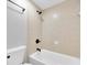 A renovated bathroom featuring a bath tub with updated fixtures and shower head at 406 W Cedar St # 403, Tampa, FL 33606